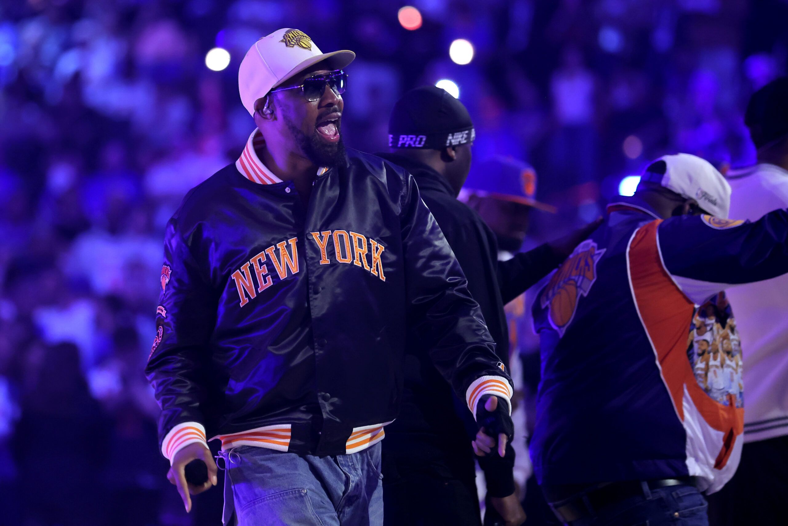 Wu-Tang Clan member performing in a New York Knicks jacket during the 2026 NBA Finals Game 4 halftime show at Madison Square Garden