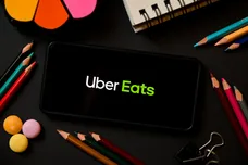 In this photo illustration a Uber Eats logo seen displayed