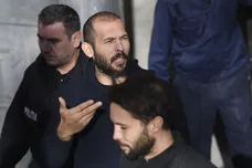 Andrew Tate leaves court after his trial in Romania