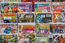 Rack of comic books for sale at a flea market