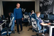 Phil Aram, manager of the Evil Geniuses Dota 2 esports team, watches his players practice at its home base - a house in a subdivision in Alameda, Calif. on Tuesday, Nov. 29, 2016