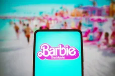 In this photo illustration, the Barbie the movie logo seen