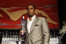 Sean "Diddy" Combs holds a bottle of Cir