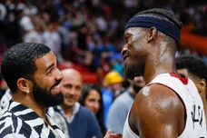 Jan 14, 2022; Miami, Florida, USA; Miami Heat forward Jimmy Butler (22) talks to Canadian rapper Drake after the game against