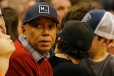 Dec 12, 2014; Phoenix, AZ, USA; American record executive and entrepreneur Russell Simmons watches an NBA game between the