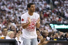 Apr 19, 2014; Toronto, Ontario, CAN; Actor and rap artist Drake cheers on his team during the Toronto Raptors game against the