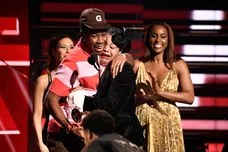 Tyler, the Creator (left) embraces his mother as he accepts the award for best rap album at the Grammy Awards.Xxx Grammys2020