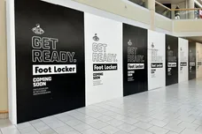 A construction barrier at Freehold Raceway Mall highlights a new Foot Locker store on the way.
