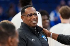 Percy Master P Miller, rapper and president of basketball operations at New Orleans, greets Memphis mens basketball coach