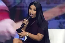 Nicki Minaj takes the stage with Erika Kirk at the Phoenix Convention Center during the final day of AmericaFest on Dec. 21,
