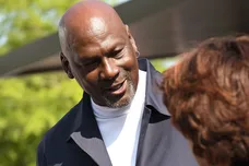 Michael Jordan takes the time to pose for a few photos and greet spectators and friends outside of The Michael Jordan Family