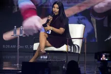 Nicki Minaj takes the stage with Erika Kirk at the Phoenix Convention Center during the final day of AmericaFest on Dec. 21,