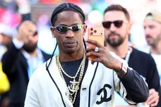 Feb 8, 2026; Santa Clara, CA, USA; Recording artist Travis Scott looks on from the sidelines before Super Bowl LX between the