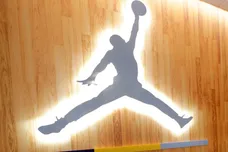 A hallway of the locker room, leading to the coaches office features an Air Jordan logo. The Marquette mens' basketball team