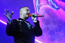 Reggaeton singer J Balvin is surrounded by dinosaurs on stage during his Sunday night show at the Don Haskins Center.3 J