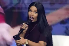 Nicki Minaj takes the stage with Erika Kirk at the Phoenix Convention Center during the final day of AmericaFest on Dec. 21,