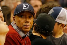 Dec 12, 2014; Phoenix, AZ, USA; American record executive and entrepreneur Russell Simmons watches an NBA game between the