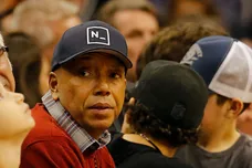 Dec 12, 2014; Phoenix, AZ, USA; American record executive and entrepreneur Russell Simmons watches an NBA game between the