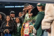 Claressa Shields, center, stands with Papoose and members of her team after defeating Franchon Crews-Dezurn, left, by a
