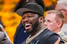 Rapper 50 Cent (left) chats on the sideline Tuesday, May 27, 2025, before Game 4 of the NBA Eastern Conference Finals at