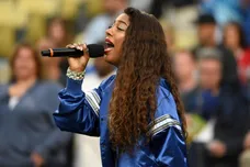 May 16, 2016; Los Angeles, CA, USA; Recording artist Victoria Monet sings the national anthem before an interleague MLB game