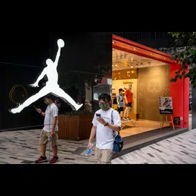 A pedestrian walks past the American sportwear brand and