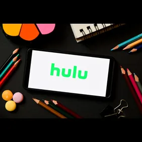 In this photo illustration a Hulu logo seen displayed on a