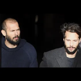 Andrew Tate leaves court after his trial in Romania