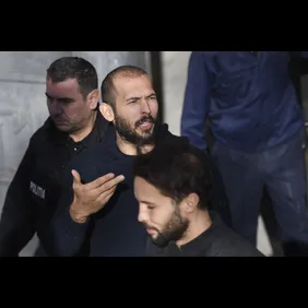 Andrew Tate leaves court after his trial in Romania