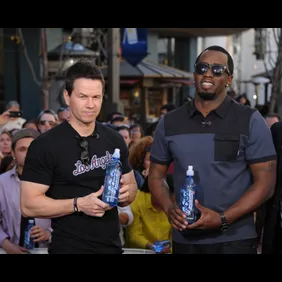 Jimmie Johnson, Mark Wahlberg, And Sean Combs On "Extra"