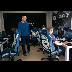 Phil Aram, manager of the Evil Geniuses Dota 2 esports team, watches his players practice at its home base - a house in a subdivision in Alameda, Calif. on Tuesday, Nov. 29, 2016