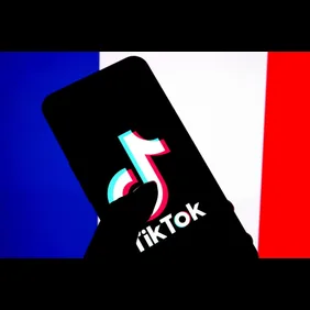 In this photo illustration, a Tiktok logo is seen displayed