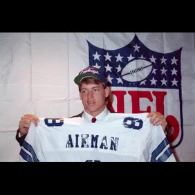Troy Aikman Holding Jersey