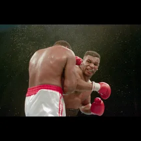 Mike Tyson Delivers KO Punch To Larry Holmes
