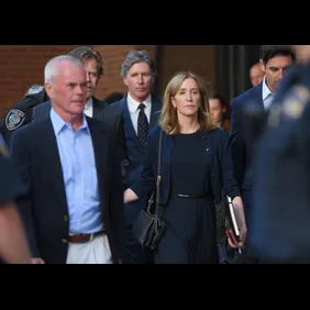 BOSTON, MA- SEPTEMBER, 13, 2019:   William H. Macy leaves Moakley Federal Courthouse with his wife Felicity Huffman who was sentenced to 14 days in prison for the college admission scam on September 13, 2019 (Staff Photo By Faith Ninivaggi/ Boston Herald/