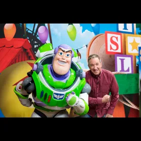Tim Allen poses with Buzz Lightyear for Toy Story Land