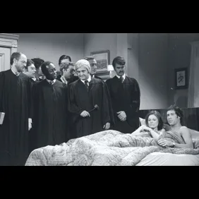 Supreme Court Watching Couple in Bed