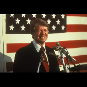 Jimmy Carter In Front Of U.S. Flag
