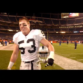 BRONCOS VS. RAIDERS -- Oakland's Bill Romanowski leaves the field after the winning of the game against Denver on Monday. Oakland won 34-10. (The Denver Post/ hyoung Chang)