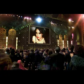 Members of the audience rise upon the appearance o