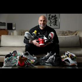 Former Cincinnati Bearcats basketball player Alex Meacham sits for a portrait with his favorite Jordan brand basketball shoes,
