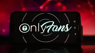 In this photo illustration the OnlyFans logo seen displayed