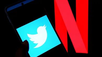 In this photo illustration, a Twitter logo is displayed on a