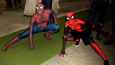 Spiderman cosplayers pose during the 29th edition of Romics