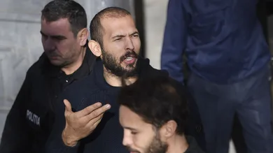 Andrew Tate leaves court after his trial in Romania