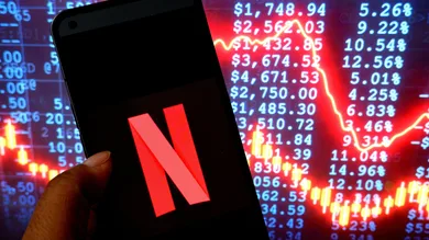 In this photo illustration, a Netflix logo is seen displayed