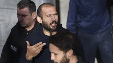 Andrew Tate leaves court after his trial in Romania