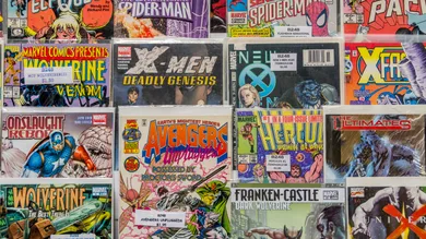 Rack of comic books for sale at a flea market