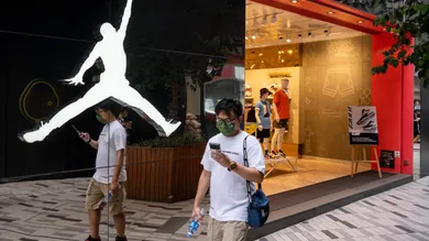 A pedestrian walks past the American sportwear brand and