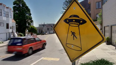 UFO/C/30AUG98/MN/MAC  =  STREET SIGNS FOR SAFETY OF PEDESTRIANS /  On Roosevelt Way at Loma Vista in San Francisco, the Dept. of Public Works has erected a yellow warning sign at the curve of the road. Originally placed it contained no text or symbols but